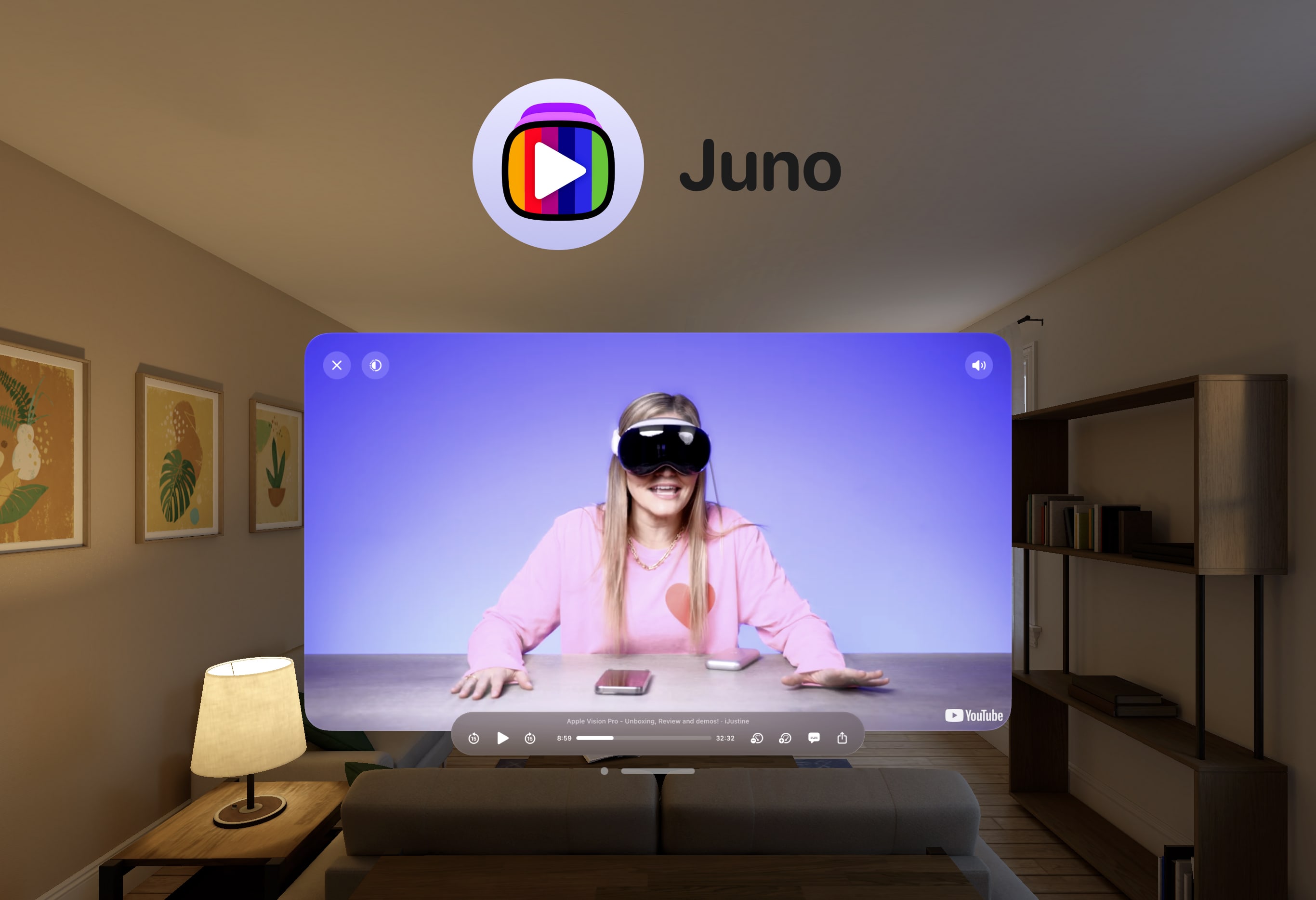 Apple Vision Pro view of a living room with a floating window showing an iJustine video with the Juno app icon floating above it