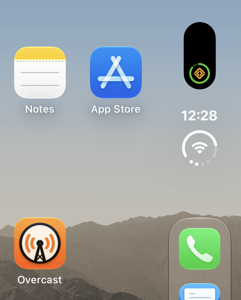 Rivian app Dynamic Island live activity on iPhone Duo showing approximately 85% charge and only taking up a small, normal vertical area.